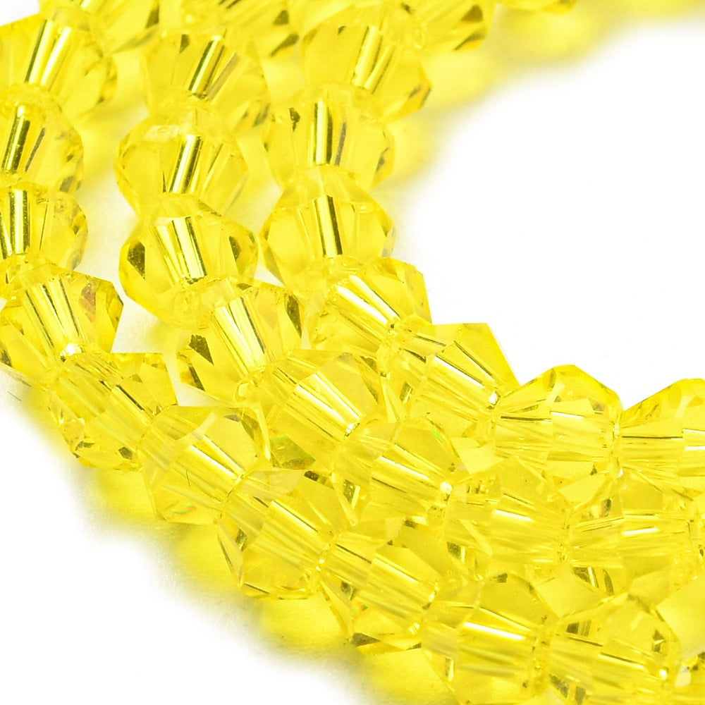 x1 Fil de Perles de Verre Transparentes Facettées – Biconiques 4 mm – Jaune