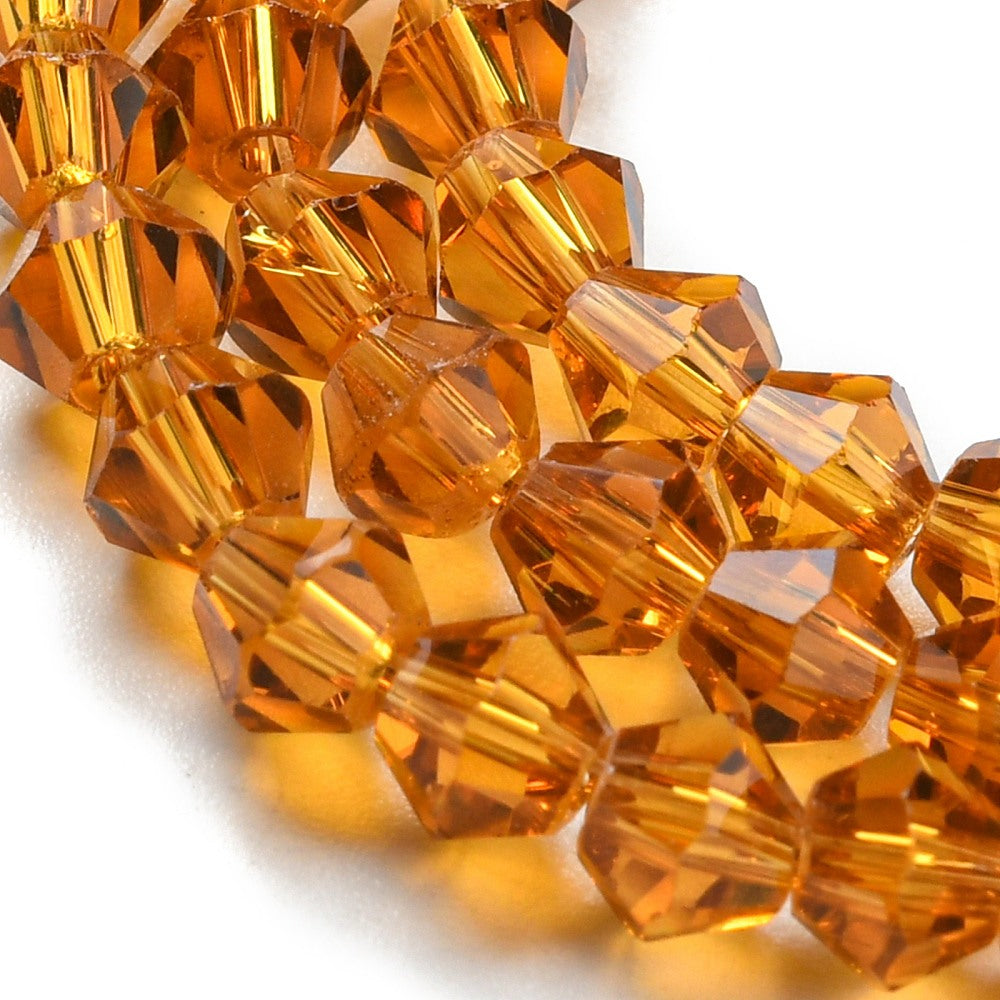 x1 Fil de Perles de Verre Transparentes Facettées – Biconiques 4 mm – Ambré