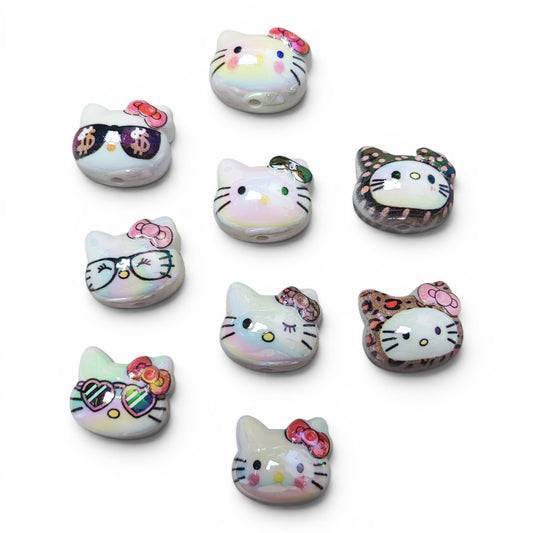 Perles têtes d’Hello Kitty en acrylique – Plusieurs modèles au choix – 23 x 20 mm