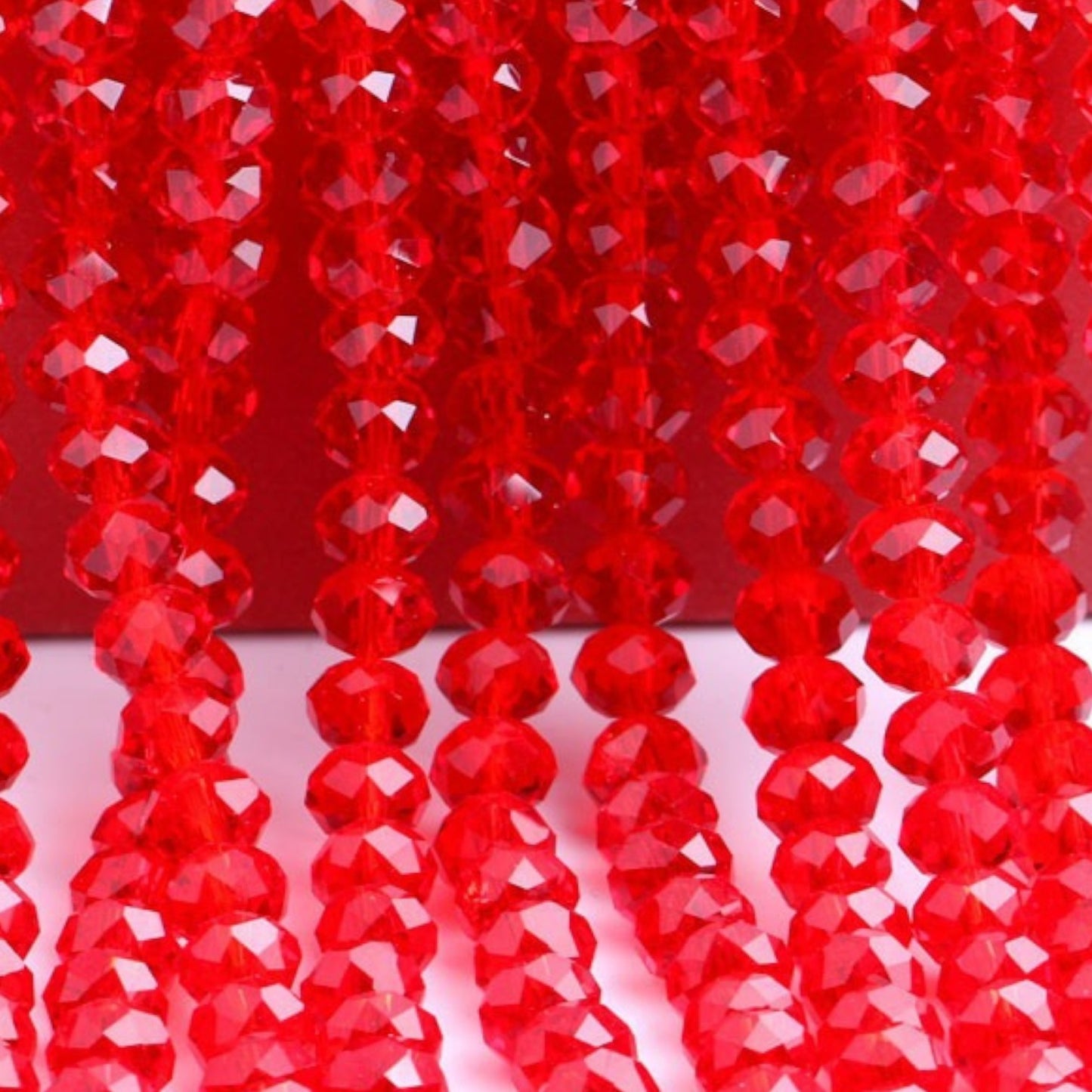 Fil de 58 Perles en Verre à Facettes – Rouge – 10×7 mm