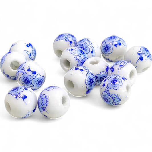 x1 Perle en Céramique Blanche à Fleurs – Ø10 mm