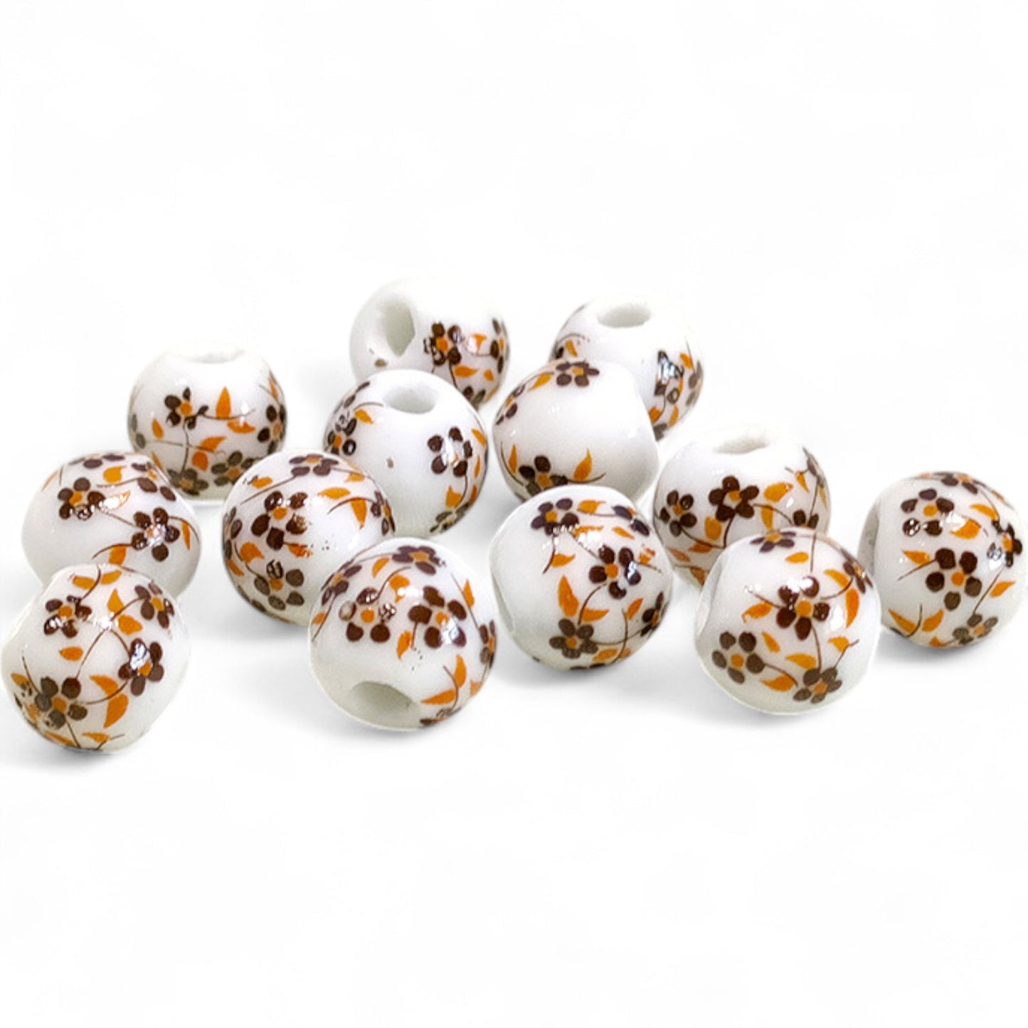 x1 Perle en Céramique Blanche à Fleurs – Ø10 mm