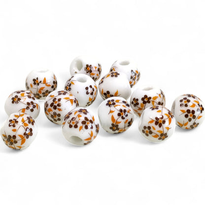 x1 Perle en Céramique Blanche à Fleurs – Ø10 mm