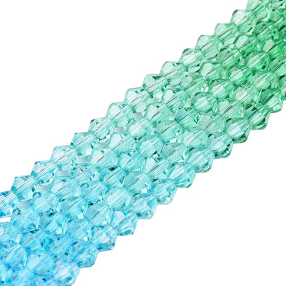 x1 Fil de Perles de verre – Biconiques facettées dégradées 6 mm – Vert et Bleu