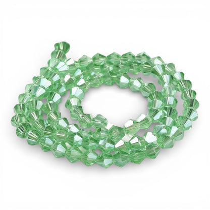 x1 Fil de Perles de Verre Transparentes Facettées – Biconiques 4 mm – Vert Clair AB