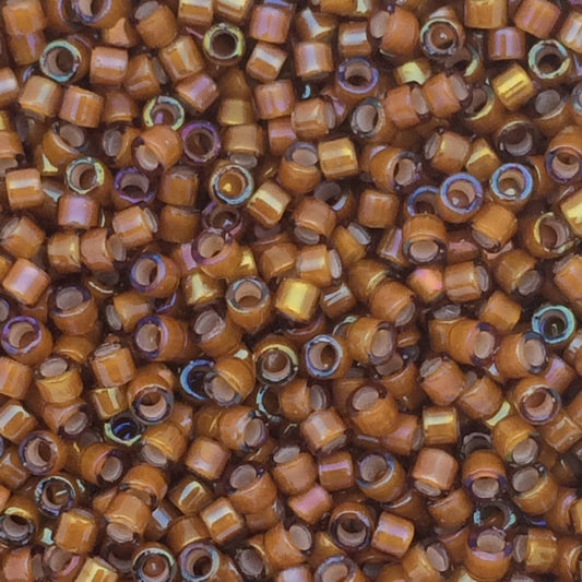 8g perles Miyuki Delicas 11/0, White Lined Dark Topaz AB: DB1779