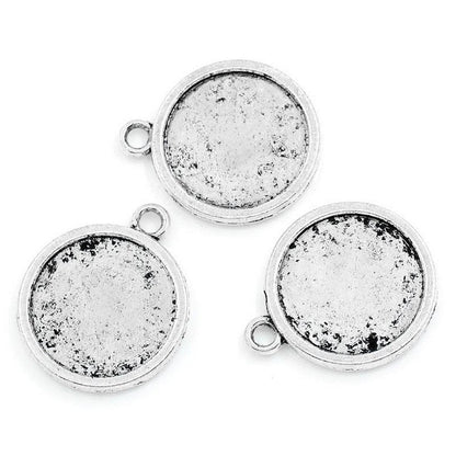 x1 Pendentif double face pour cabochon 20 mm – Métal argenté vieilli
